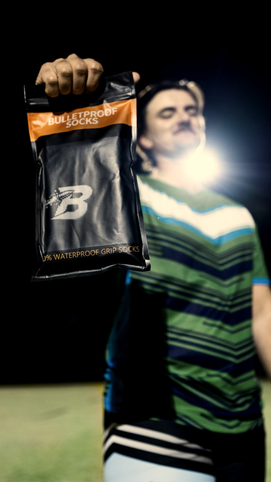 A bag of Bulletproof Socks held up under a floodlight.