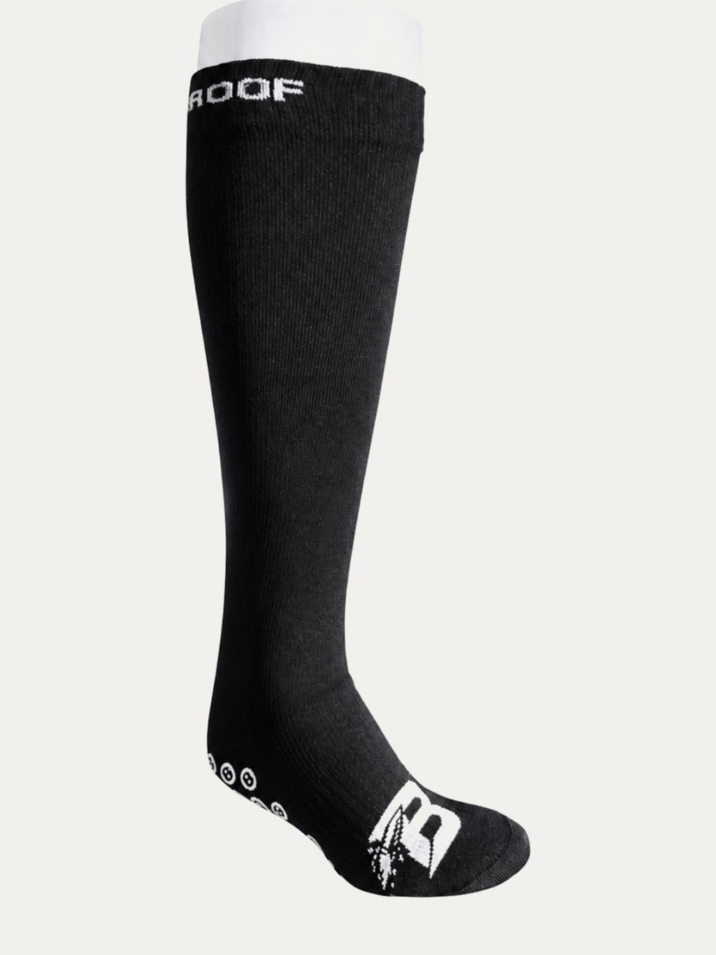 Long Bulletproof waterproof grip sock, knee height, three-quarter view with the B logo on the toe and grip dots along the sole.