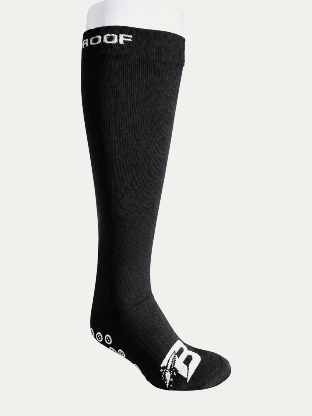 Long Bulletproof waterproof grip sock, knee height, three-quarter view with the B logo on the toe and grip dots along the sole.