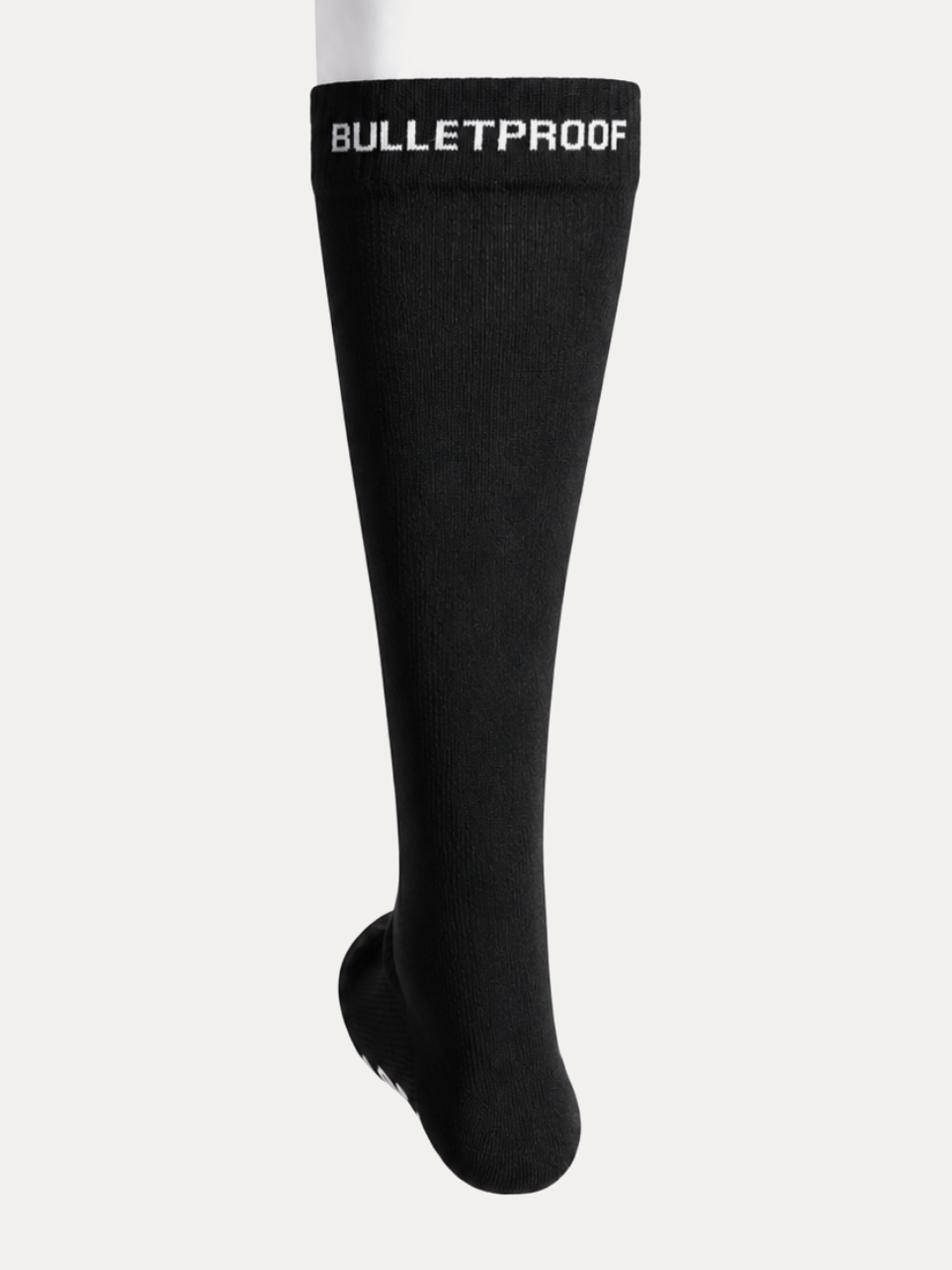 Long Bulletproof grip sock seen front on, knee height, with BULLETPROOF knitted into the cuff.